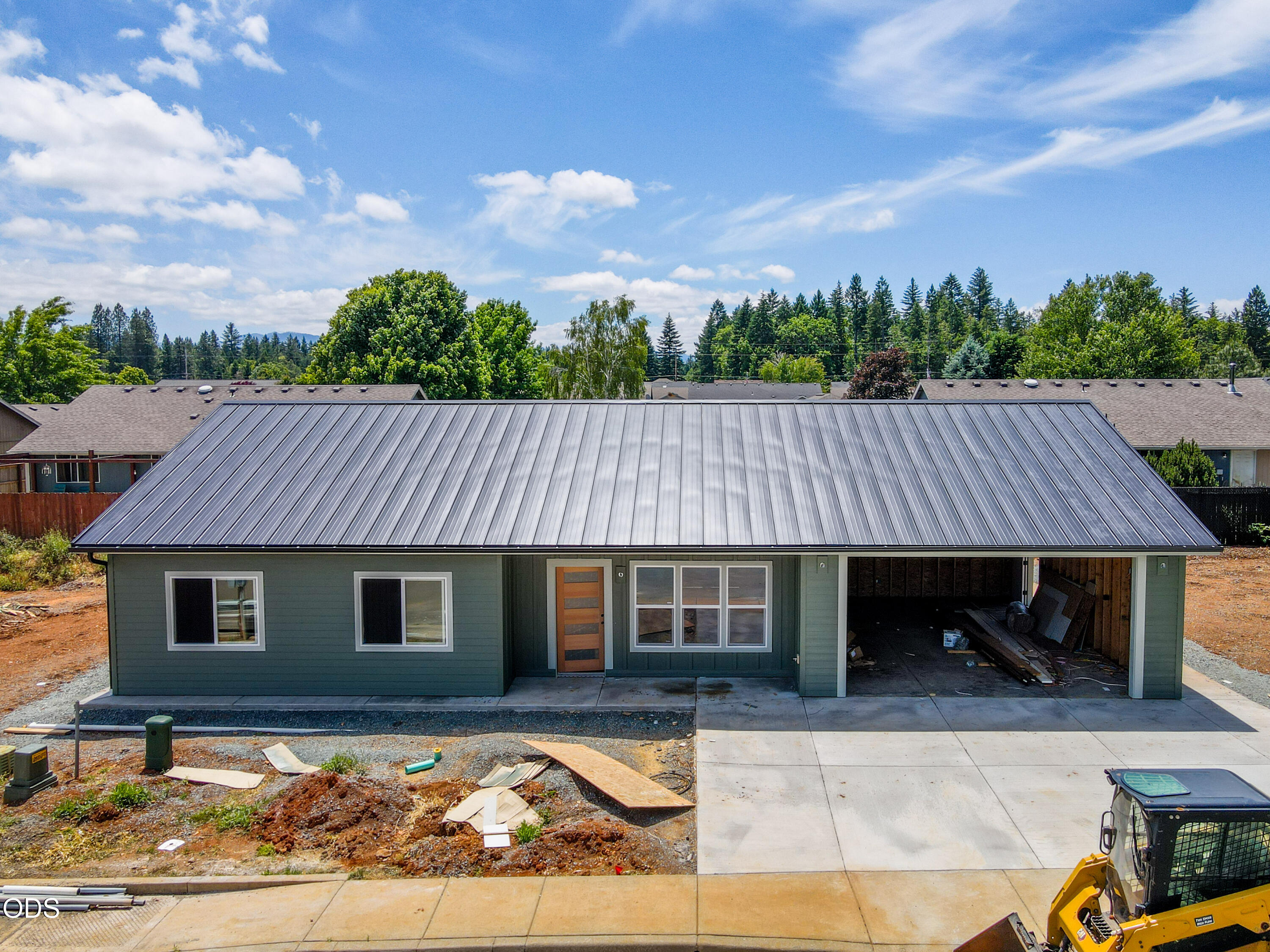 405 Cece Lane Cave Junction, OR 97523 - Photo 1 of 15 a front view of a house with garden
