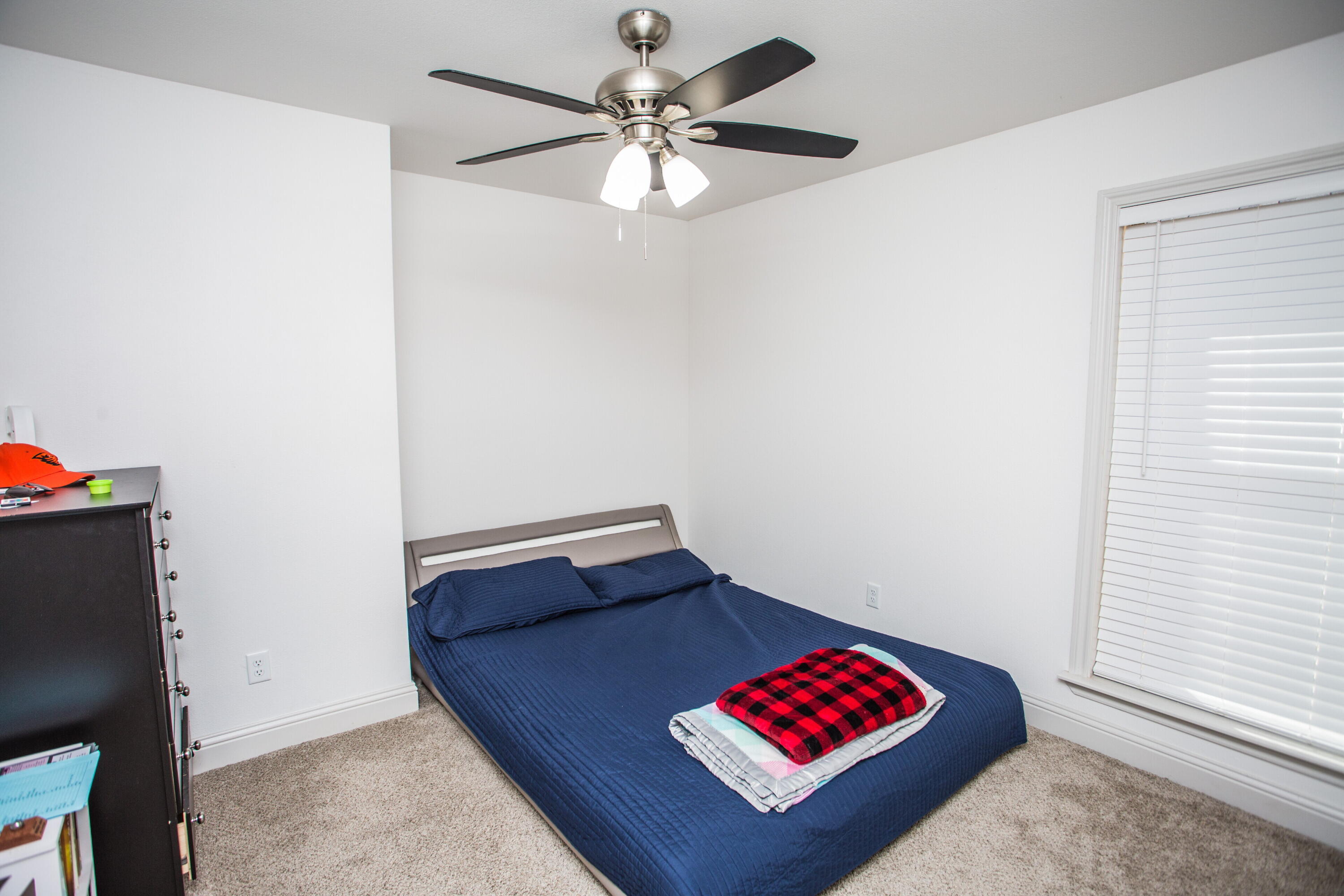 816 North 4th Street Wolfforth, TX 79382 - Photo 18 of 25 a view of room with a ceiling fan and a rug