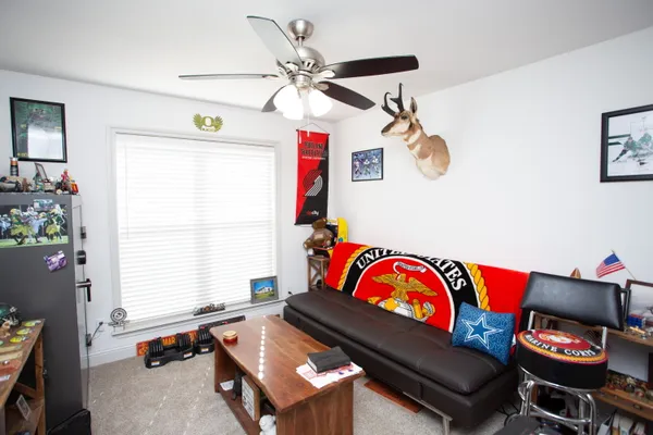 a living room with furniture and window