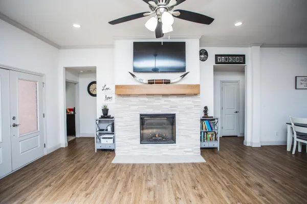a living room with a fireplace and a flat screen tv