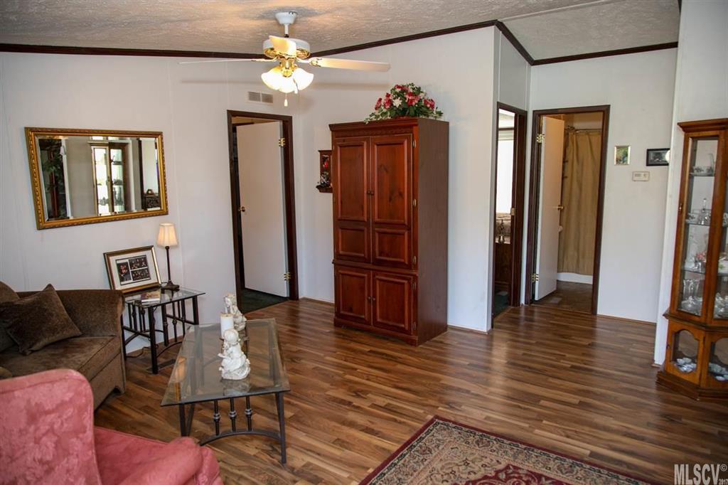 8843 Mull Road Vale, NC 28168 - Photo 20 of 25 a living room with furniture and a chandelier
