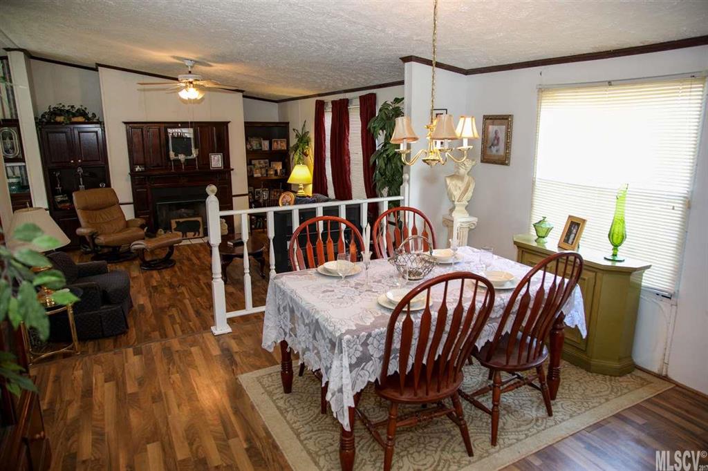8843 Mull Road Vale, NC 28168 - Photo 23 of 25 a view of a dining room with furniture window and wooden floor
