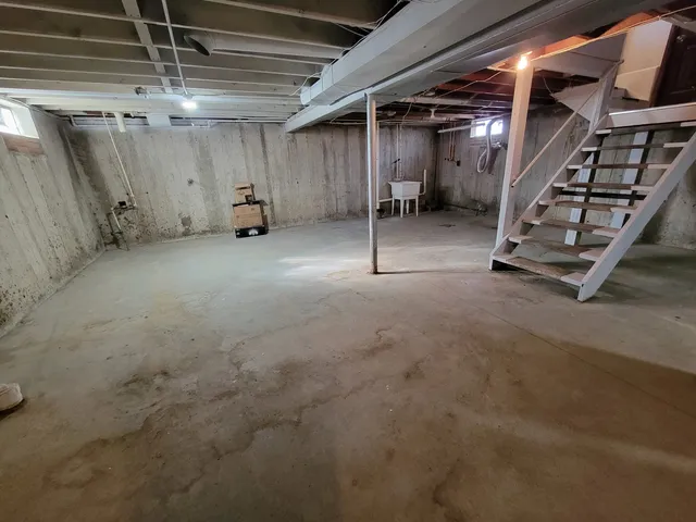 a view of dirt yard with a large tree