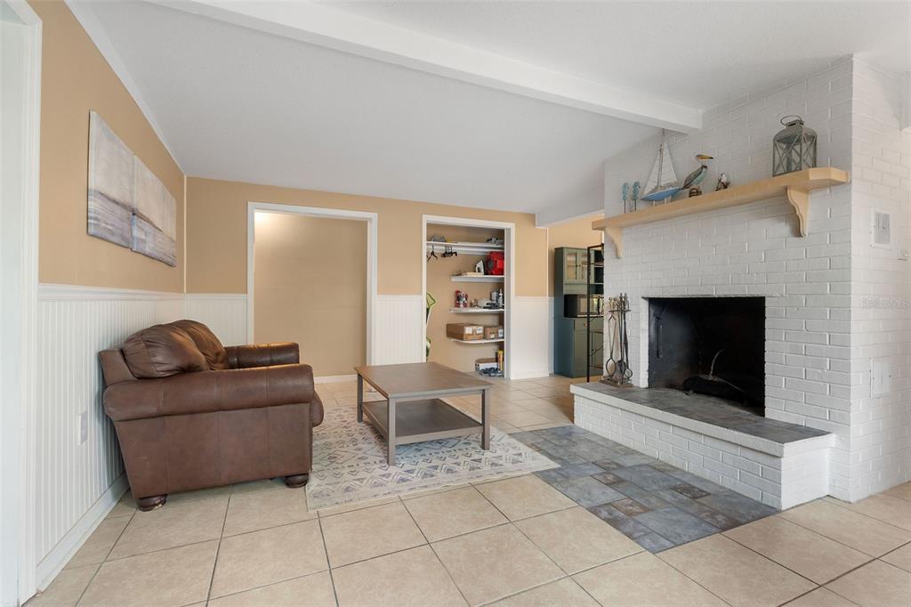 6129 Beacon Point Drive Weeki Wachee, FL 34607 - Photo 6 of 30 a living room with furniture and a fireplace