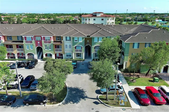 an aerial view of multiple houses on a city street