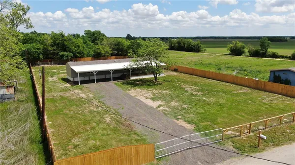 a view of yard with swimming pool and seating