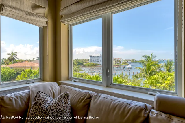a bed sitting in front of a window