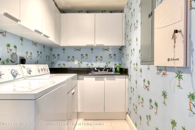 a kitchen with stainless steel appliances a white refrigerator a sink and a stove