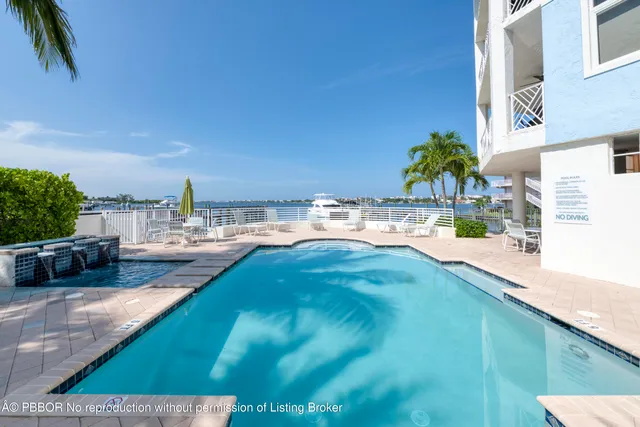 a view of a swimming pool with a patio