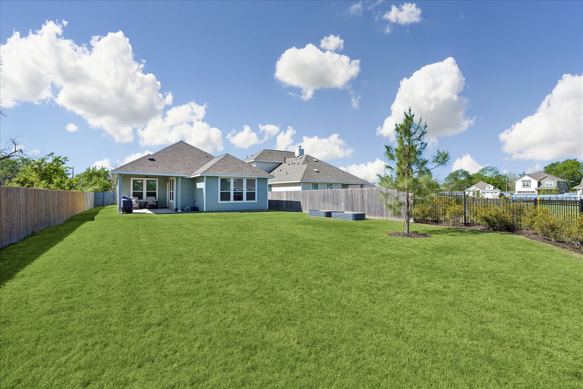 33002 Carolyns Perfection Loop Fulshear, TX 77441 - Photo 27 of 29 a front view of house with yard and green space