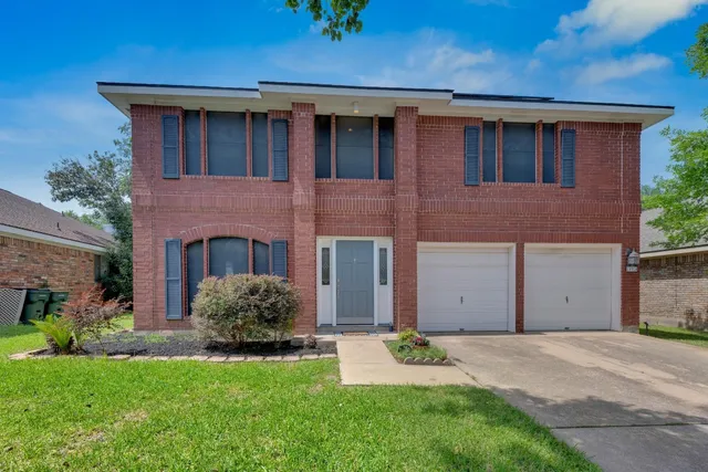 a house view with a garden space