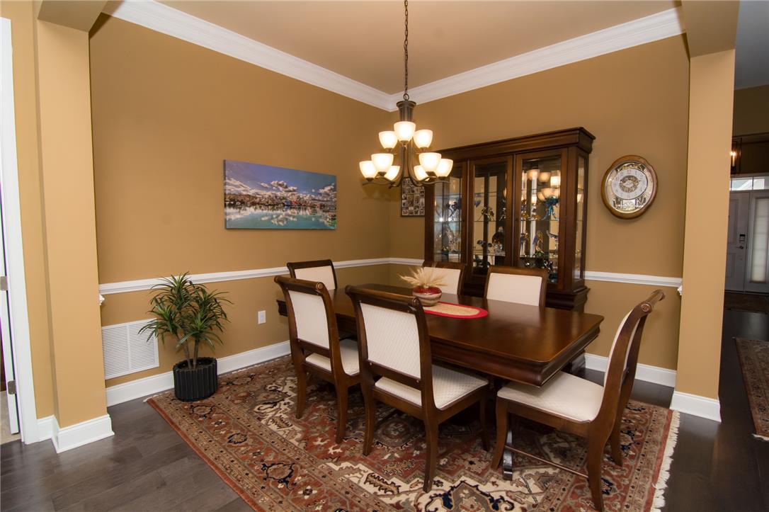 4097 Rutz Lane Allentown, PA 18104 - Photo 18 of 59 Elegant crown molding and rich hardwood flooring define this formal dining space.