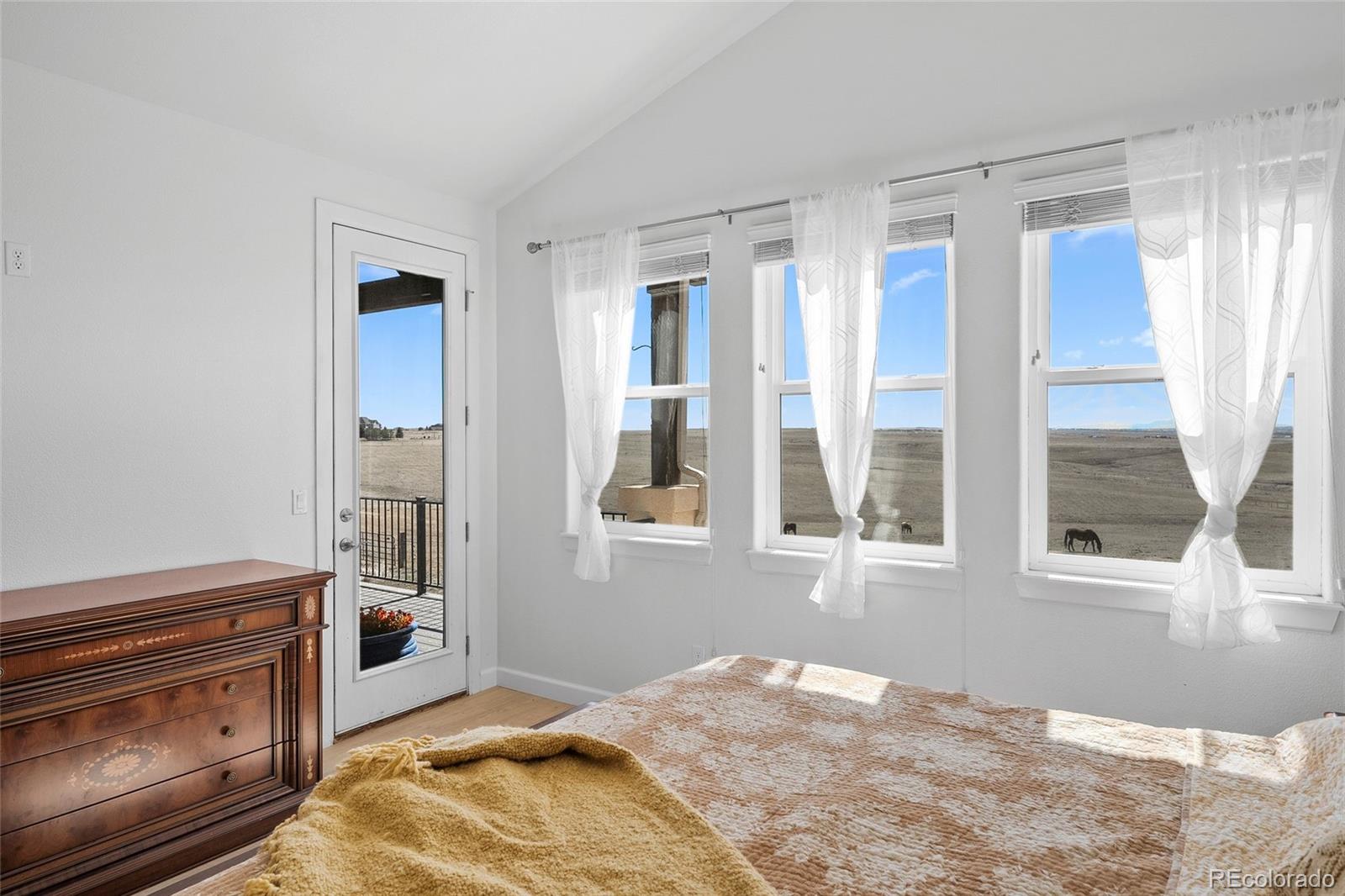 7600 Patrick Trail Elizabeth, CO 80107 - Photo 12 of 45 a bedroom with a bed and a window