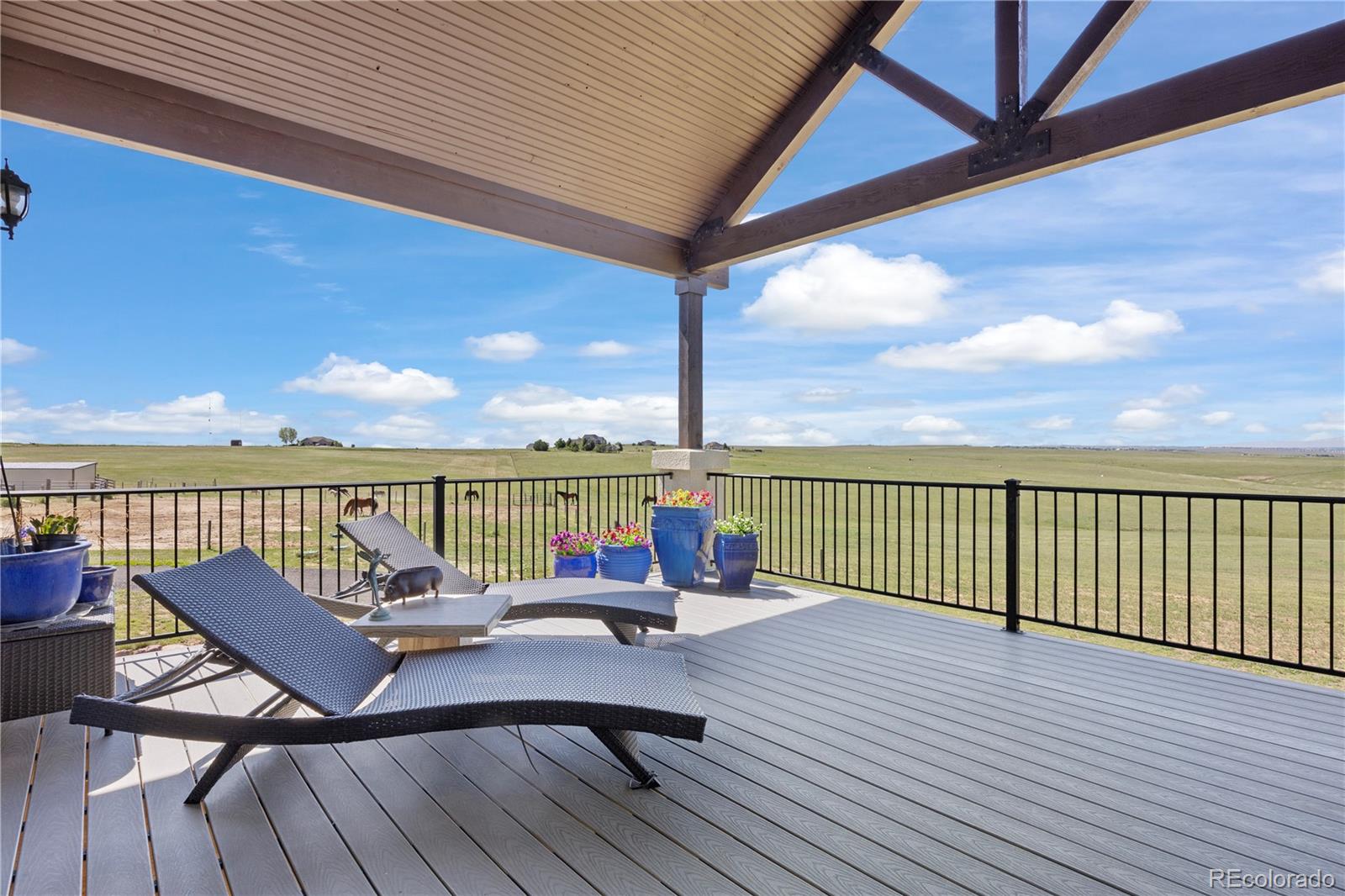 7600 Patrick Trail Elizabeth, CO 80107 - Photo 21 of 45 a view of a balcony with wooden floor