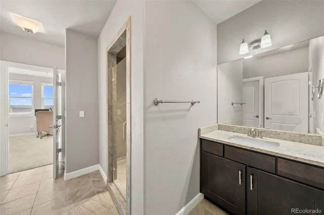 a view of a utility room with clothes and shoes