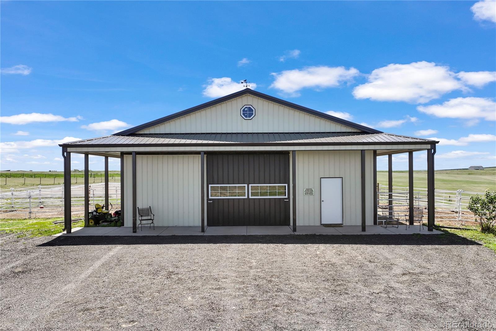 7600 Patrick Trail Elizabeth, CO 80107 - Photo 29 of 45 a front view of a house with a yard and garage