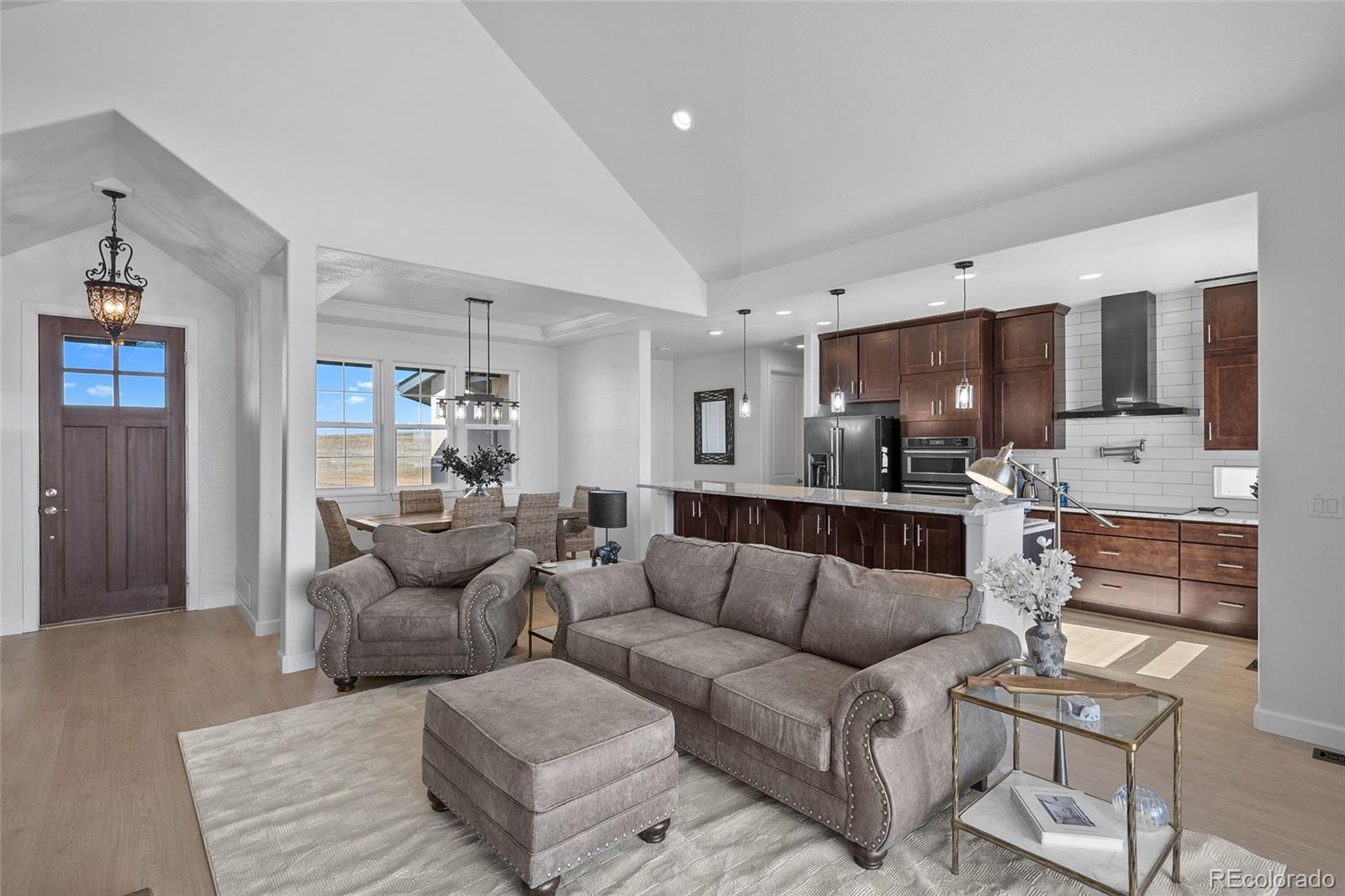 7600 Patrick Trail Elizabeth, CO 80107 - Photo 4 of 45 a living room with furniture and a flat screen tv