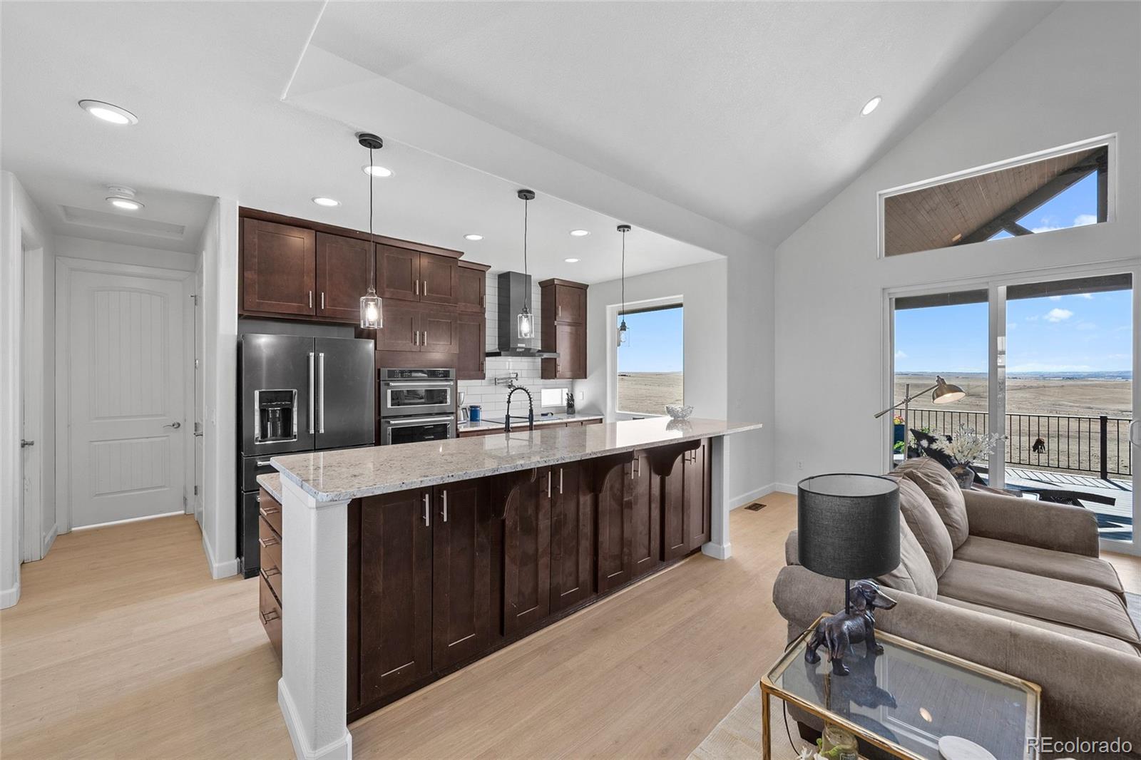 7600 Patrick Trail Elizabeth, CO 80107 - Photo 5 of 45 a view of kitchen with kitchen island stainless steel appliances sink refrigerator and microwave