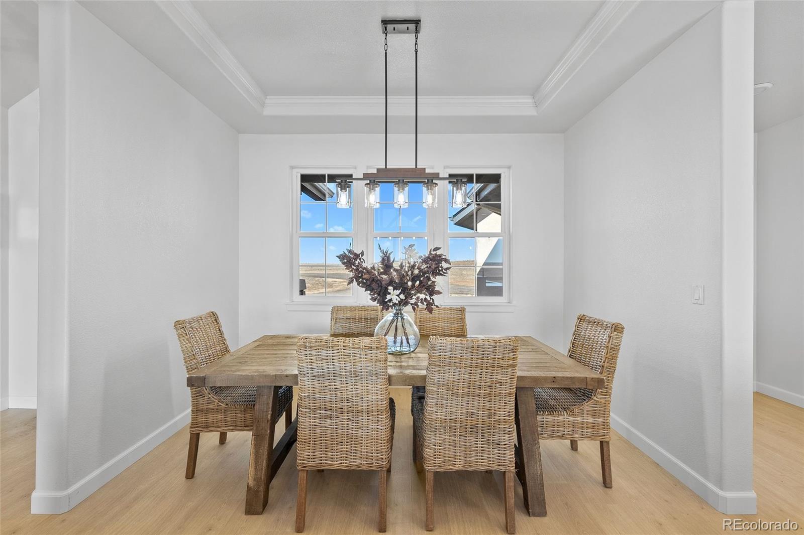 7600 Patrick Trail Elizabeth, CO 80107 - Photo 10 of 45 a view of a dining room with furniture and chandelier