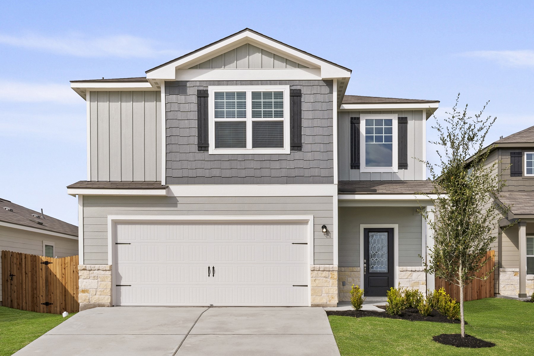 front view of a house with a yard