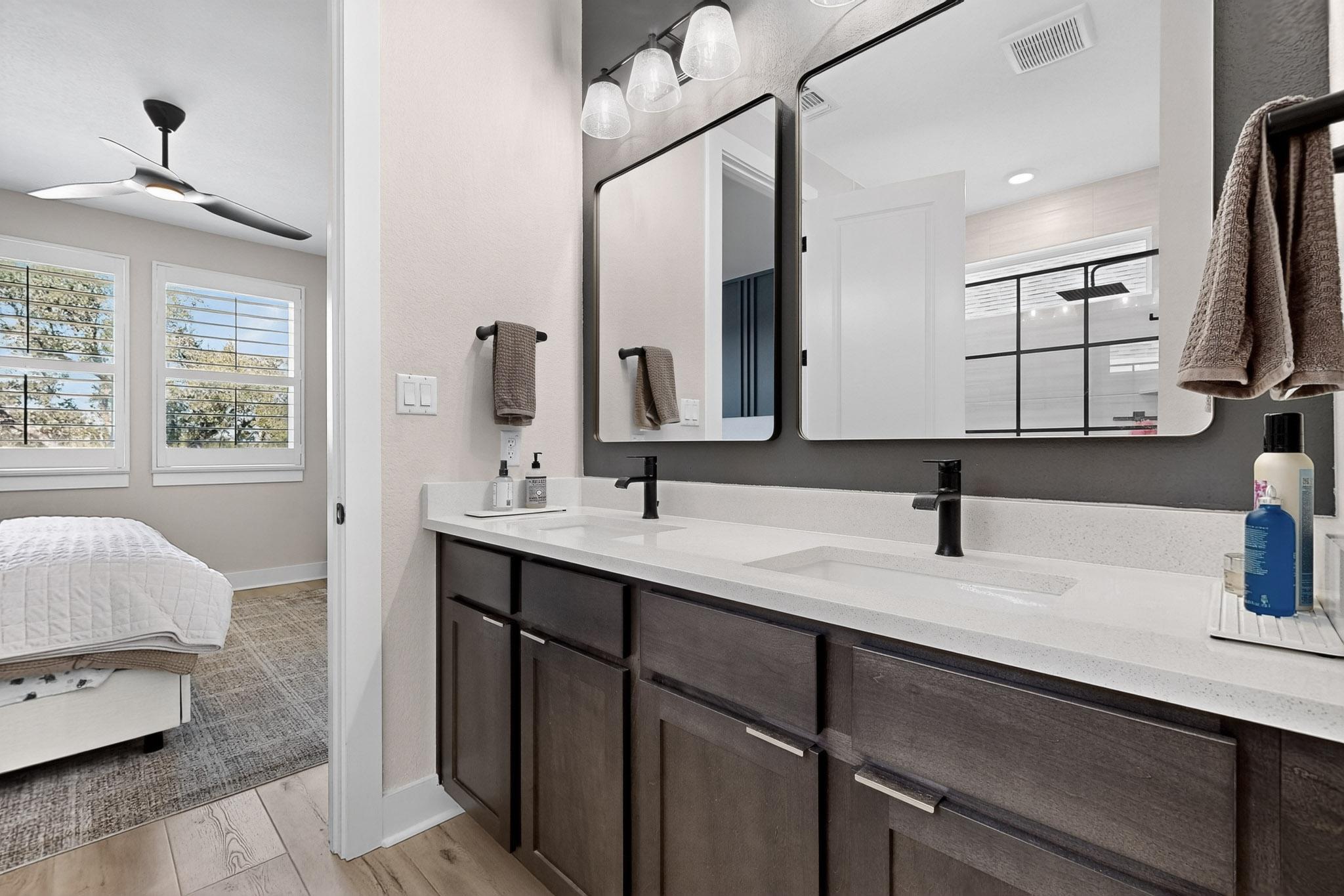 473 Bauer Loop Liberty Hill, TX 78642 - Photo 18 of 38 Ensuite bathroom featuring light wood finished floors, double vanity, and ceiling fan