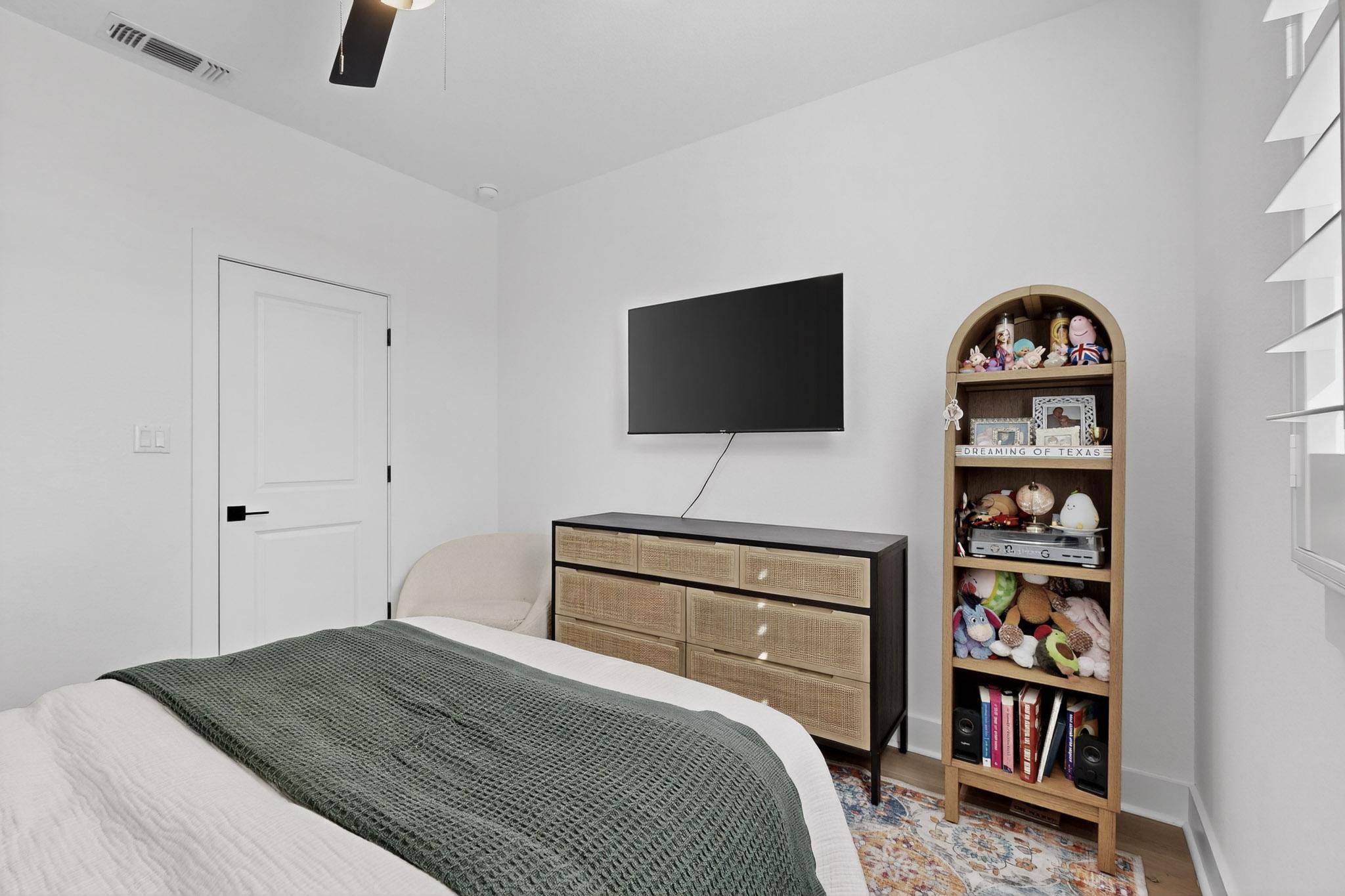 473 Bauer Loop Liberty Hill, TX 78642 - Photo 22 of 38 Bedroom #2 featuring a ceiling fan and wood finished floors
