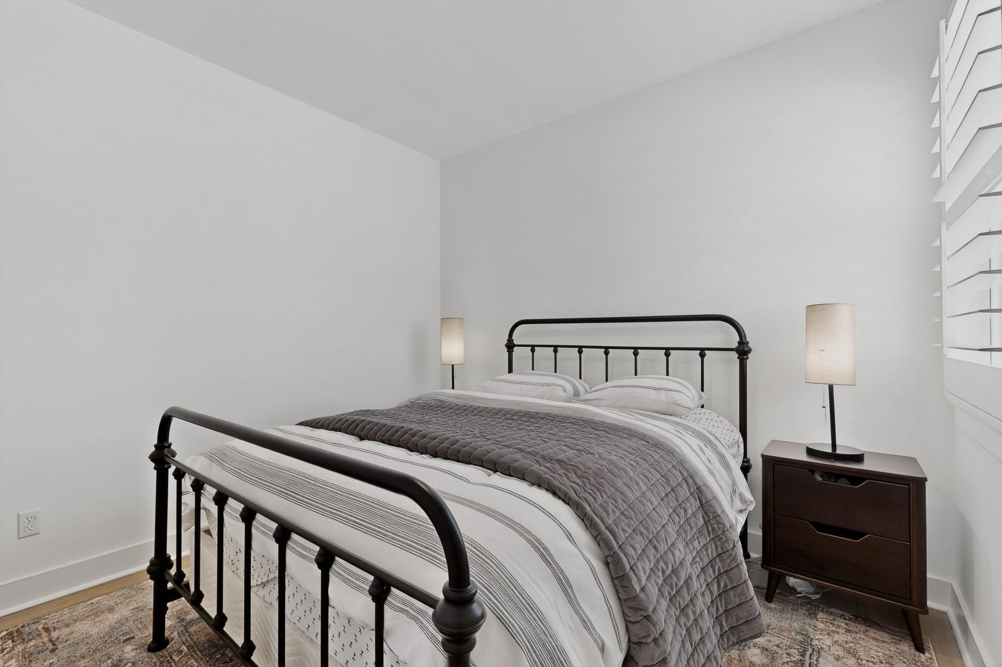 473 Bauer Loop Liberty Hill, TX 78642 - Photo 25 of 38 Bedroom featuring baseboards and wood finished floors