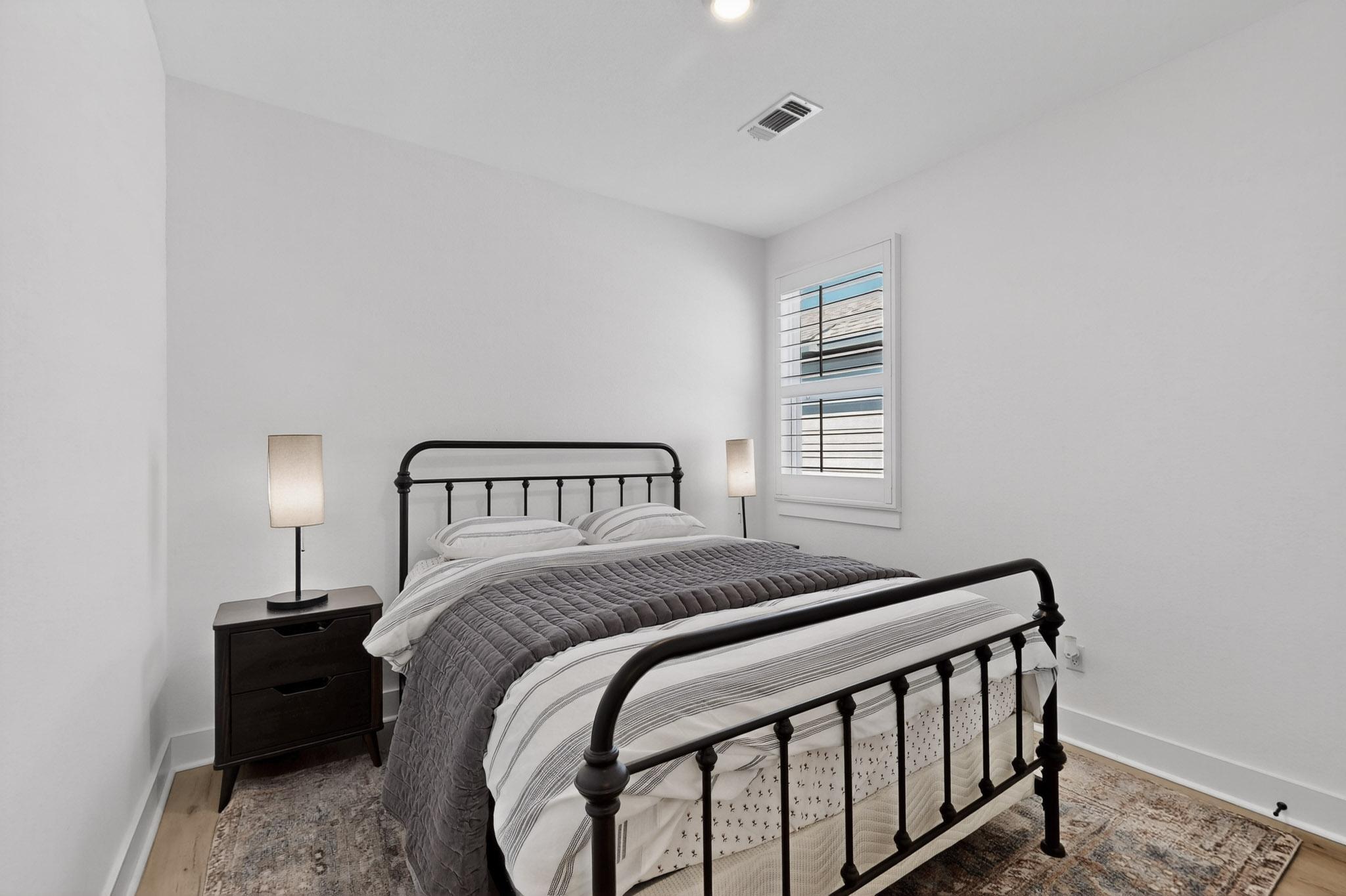 473 Bauer Loop Liberty Hill, TX 78642 - Photo 26 of 38 Bedroom #3with wood finished floors and recessed lighting