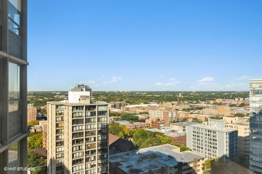 5701 North Sheridan Road, Unit 21H Chicago, IL 60660 - Photo 10 of 14 a view of a city with tall buildings