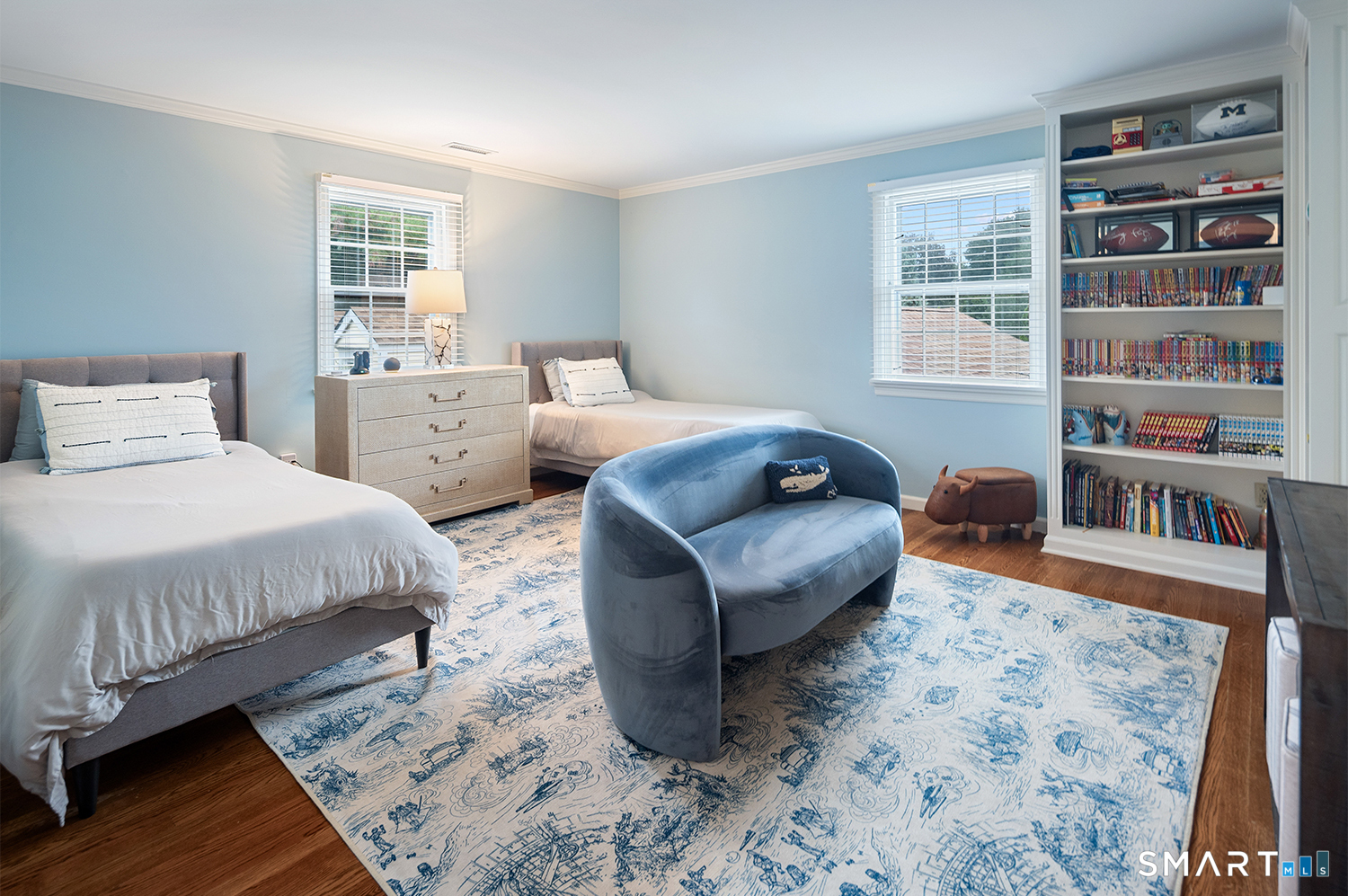 775 Sasco Hill Road Fairfield, CT 06824 - Photo 23 of 36 a bedroom with bed and a book shelf