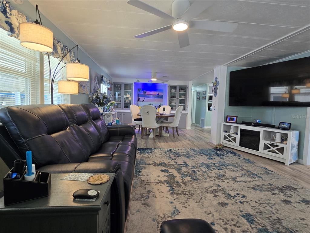 5619 Bayshore Road, Unit 435 Palmetto, FL 34221 - Photo 10 of 56 a living room with furniture and a flat screen tv