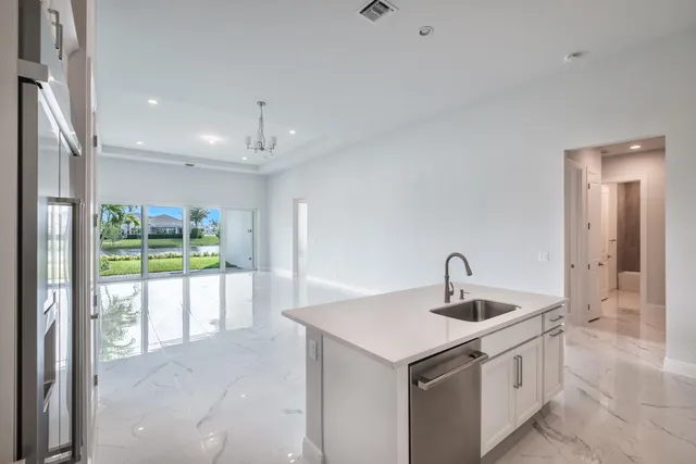 a kitchen with a sink and a refrigerator