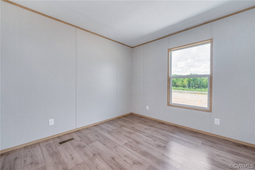 488 Chopping Road Mineral, VA 23117 - Photo 15 of 23 an empty room with wooden floor and windows