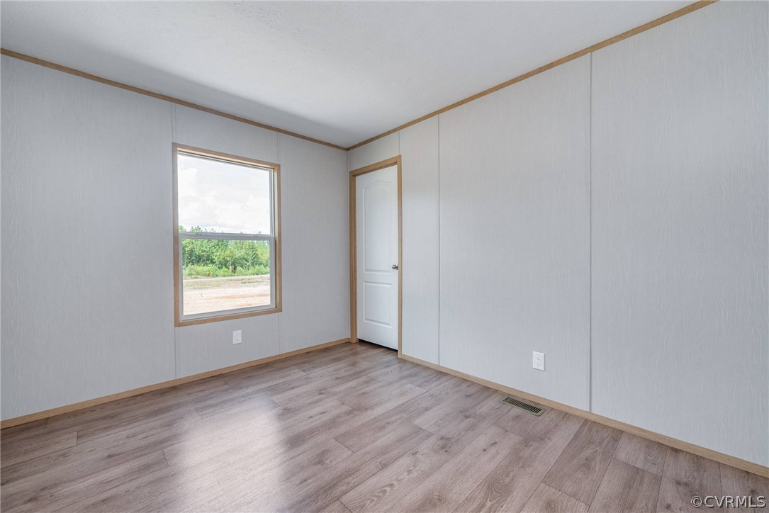 488 Chopping Road Mineral, VA 23117 - Photo 17 of 23 an empty room with wooden floor and windows