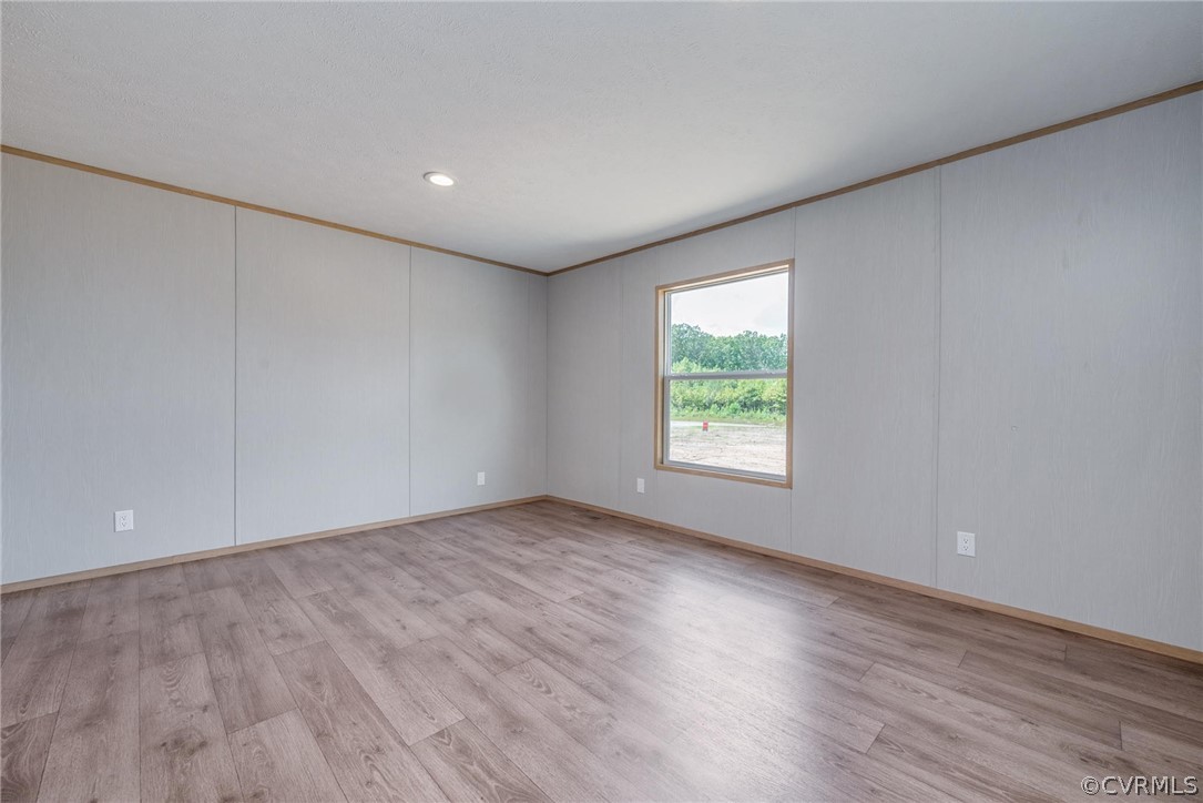 488 Chopping Road Mineral, VA 23117 - Photo 20 of 23 an empty room with wooden floor and windows