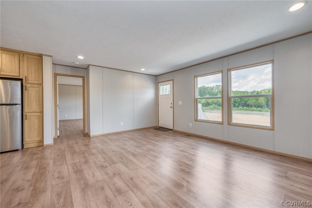 488 Chopping Road Mineral, VA 23117 - Photo 2 of 23 a view of an empty room with a window and wooden floor
