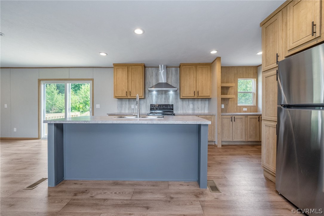 488 Chopping Road Mineral, VA 23117 - Photo 7 of 23 a kitchen with kitchen island granite countertop a refrigerator a sink a stove a microwave and wooden cabinets