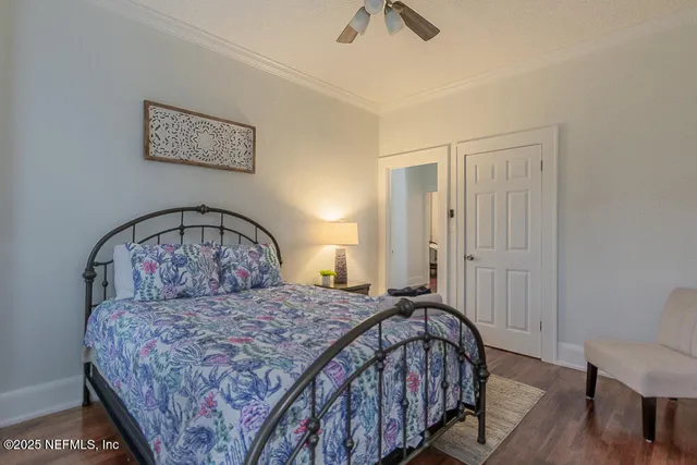 a bedroom with a bed and a view of bathroom