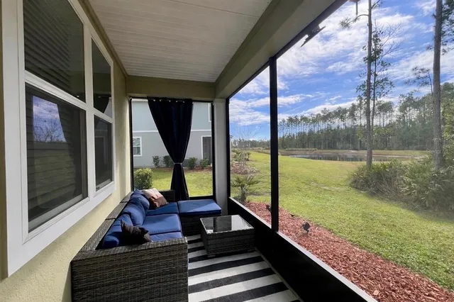 a sitting area with wooden floor