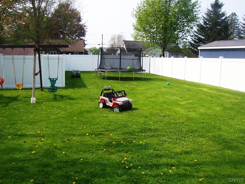 1705 North Madison Street Rome, NY 13440 - Photo 29 of 35 New White Vinyl Fenced Backyard