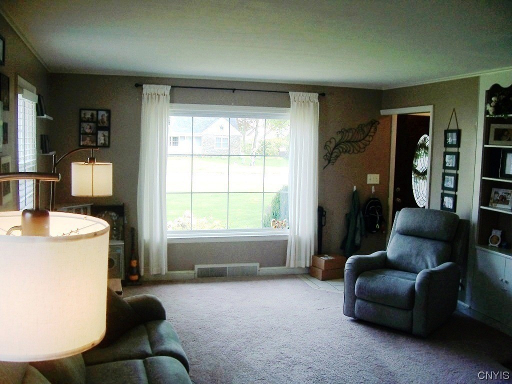 1705 North Madison Street Rome, NY 13440 - Photo 3 of 35 Living Room With Wood Fireplace, Built-In Bookshel