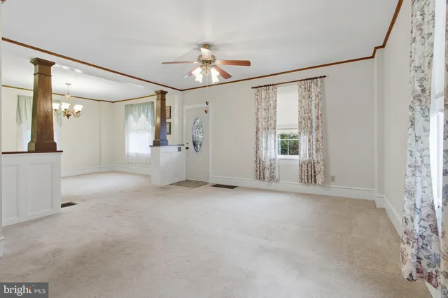 a view of an empty room with a window