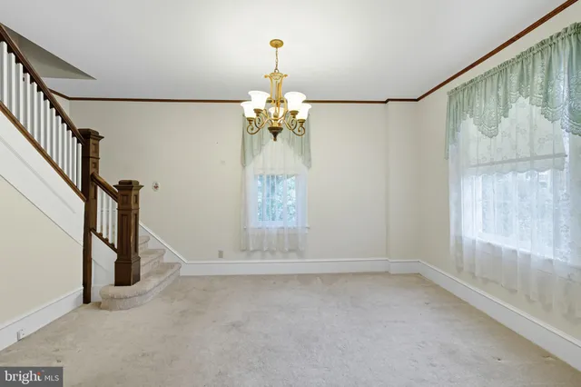 en view interior of a house with chandelier staircase and a chandelier