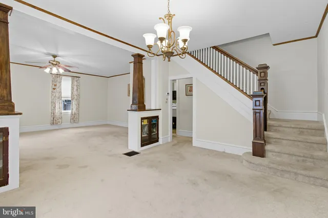 a view of a hallway with a chandelier