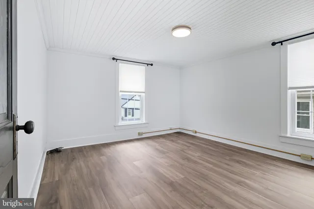 a bathroom with a sink a toilet a mirror and shower