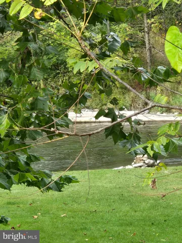 a backyard of a building with lots of green space