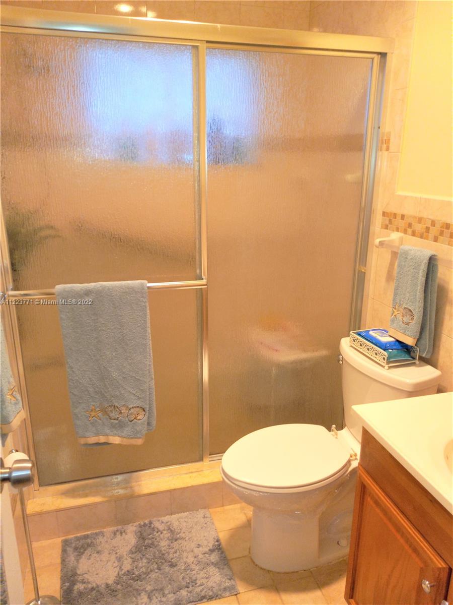 2223 Park Lane, Unit 211 Hollywood, FL 33021 - Photo 11 of 21 a bathroom with a toilet and a shower