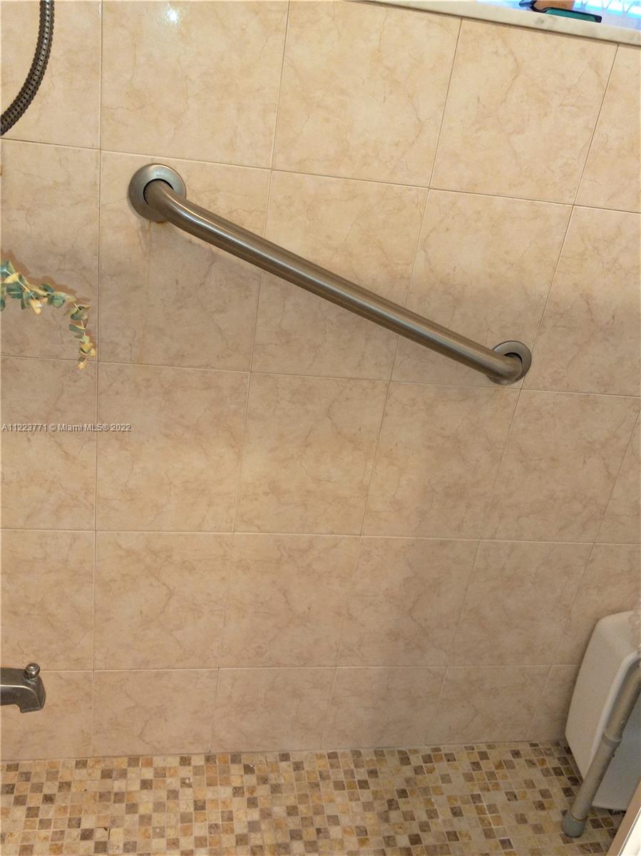 2223 Park Lane, Unit 211 Hollywood, FL 33021 - Photo 12 of 21 a bathroom with a shower