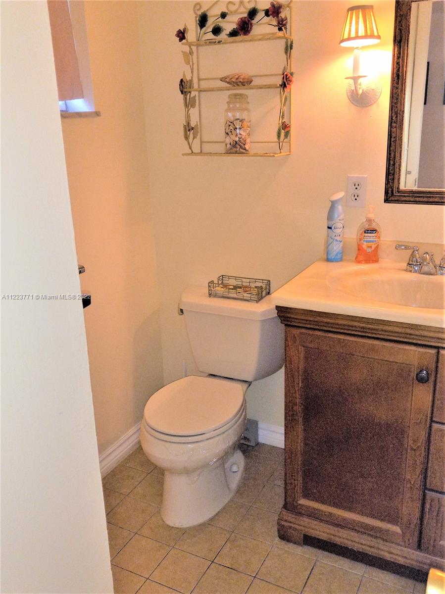 2223 Park Lane, Unit 211 Hollywood, FL 33021 - Photo 13 of 21 a bathroom with a toilet and a sink