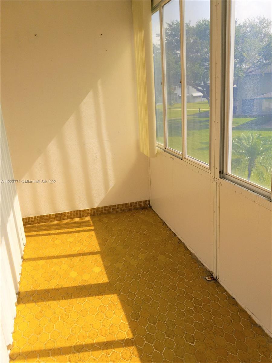 2223 Park Lane, Unit 211 Hollywood, FL 33021 - Photo 14 of 21 a view of an empty room with a window